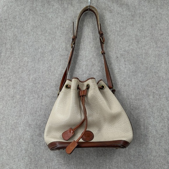 Dooney & Bourke Handbags - Dooney & Bourke Vintage Off‎ White Leather Drawstring Bucket Shoulder Bag